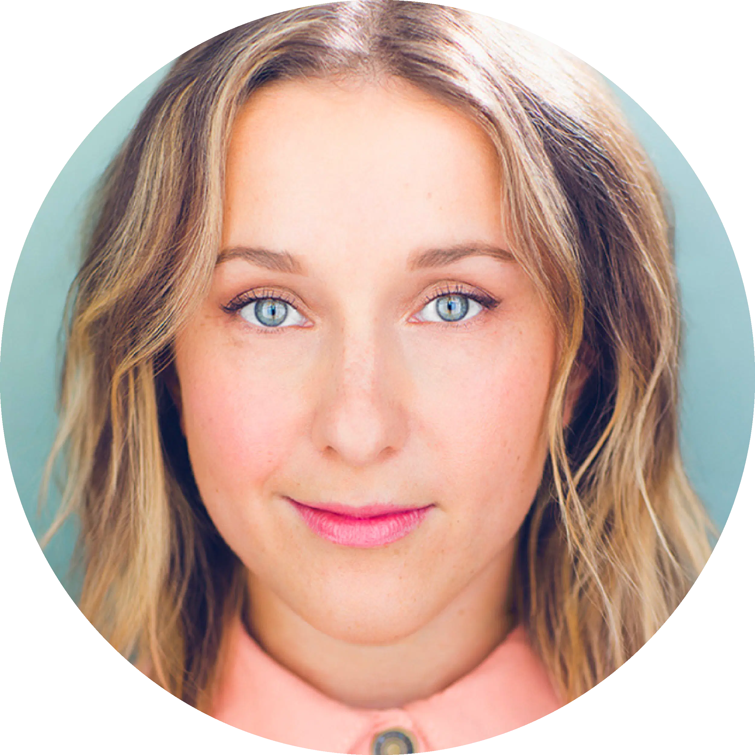 A portrait of a person with blue eyes and blonde hair, looking directly at the camera with a neutral expression, wearing a peach-colored shirt.